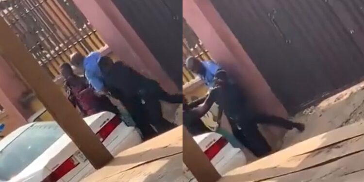 Two uniformed police officers publicly exchange blows